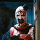 a clown covered in blood.